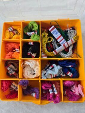 Lidded Bin of multicolored friendship bracelet thread